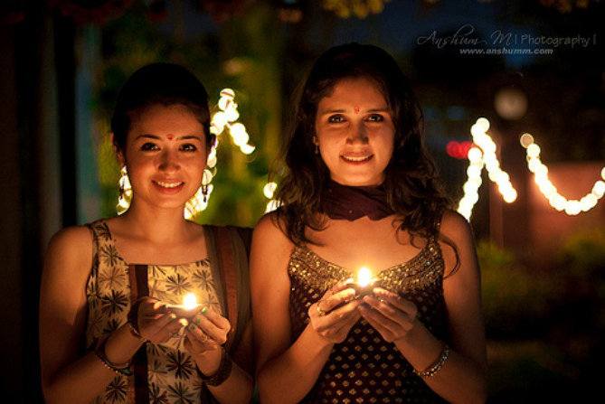 Beautiful Girls Holding Diya on Diwali