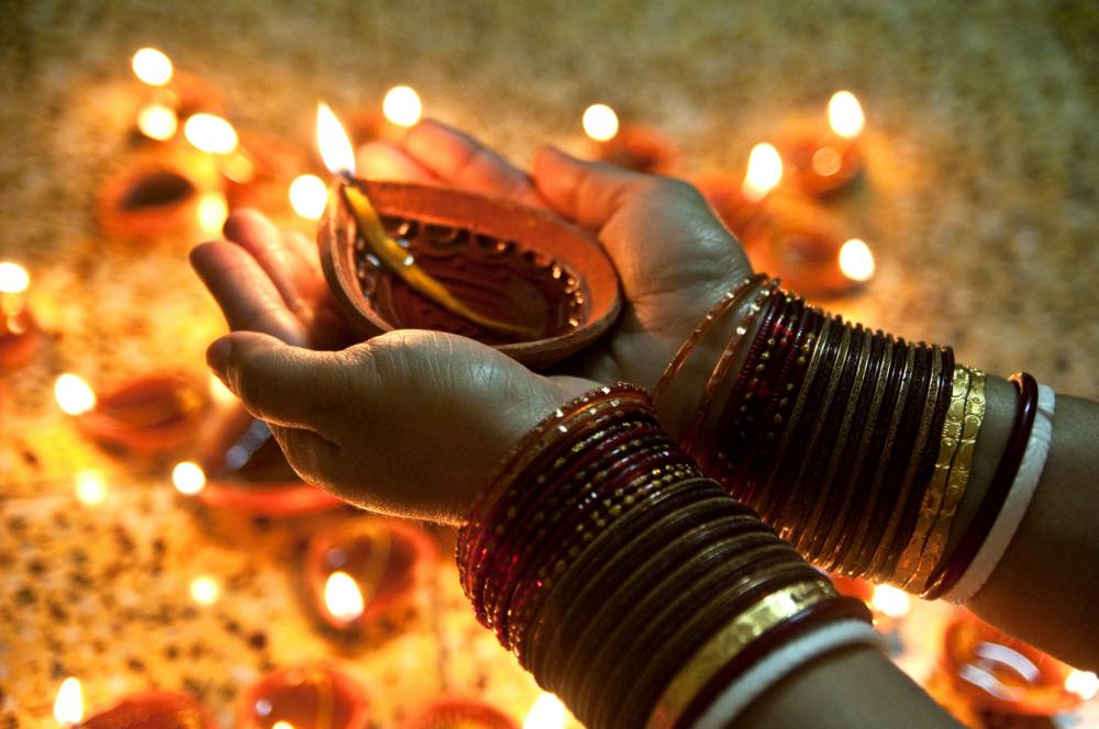 Lady On Diwali with Lamps Images