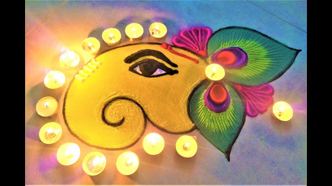 Lord Ganesh Face Rangoli with Candles Effects